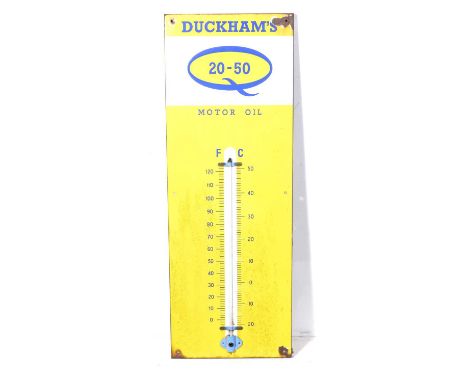 A Duckhams Motor Oil enamel thermometer sign, 91.5cm x 33cm.Condition report:The glass tube is intact with no breaks and it a