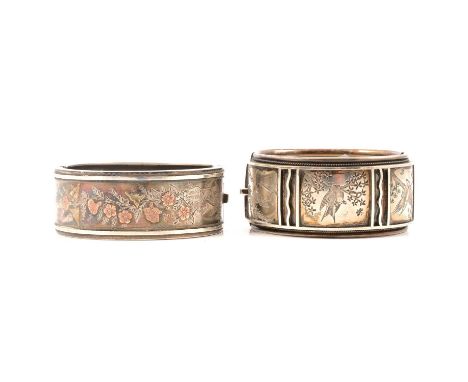 An Victorian silver half-hinged bangle, H. Bros, Birmingham 1883, tri-colour bird, insect and floral design, 25mm wide, inter