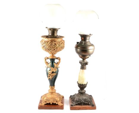 Gilt painted oil lamp, complete with opaque shade and chimney, height to fitment 63cm; and another Victorian lamp with onyx c