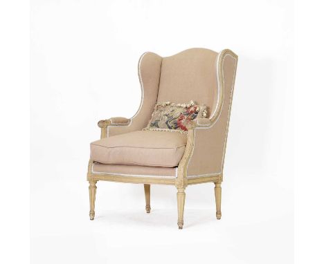 A Louis XVI-style wing armchair, with a carved and painted frame, on turned tapering legs,71cm wide71cm deep110cm high,togeth