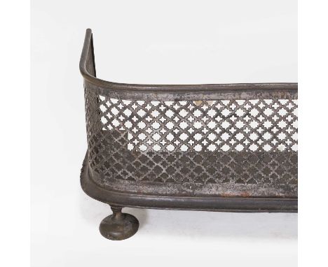 A pierced steel fender, early 19th century, the 'D'-shaped fender with brass top and bottom rails, 107cm wide23cm highConditi