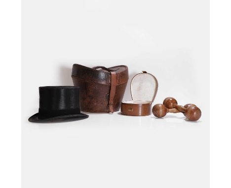 A Herbert & Johnson silk top hat, the accompanying leather hatbox with an applied brass label engraved 'W Bethell',34cm wide2