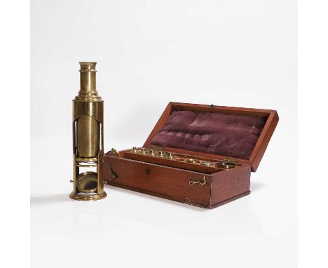 A brass student microscope, c.1900, with a selection of lenses and slides in a fitted mahogany case,case 26.5cm longCondition