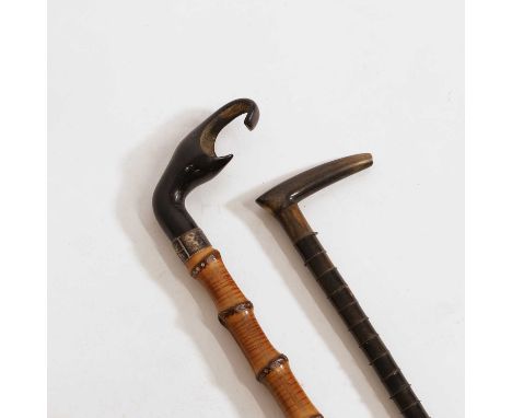 A bamboo walking stick, with an engraved white metal collar and horn ferrule,93cm long, andanother example, with a segmental 