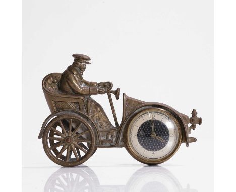 A brass-framed timepiece, 20th century, modelled as a veteran car, 16cm wide13cm highCondition ReportNo damages or losesThe t