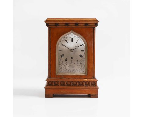 An oak library timepiece, 19th century, with a silvered pointed arch dial, inscribed 'Carter, 61 Cornhill, London' within eng