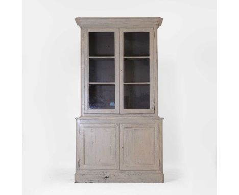 A painted housekeeper's cupboard, 19th century, French, with glazed doors above and cupboards below, on a plinth base,127cm w