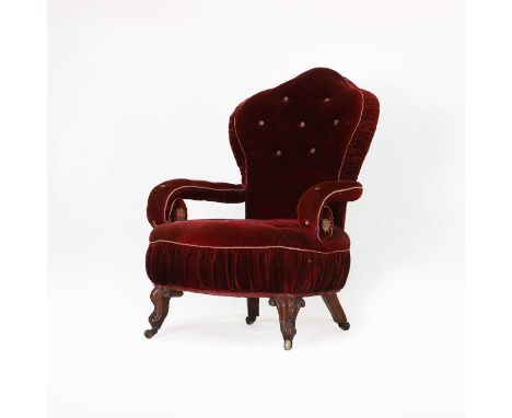 A Victorian steel-framed reclining armchair, with original red, plush, buttoned upholstery, on scrolled front legs,68cm wide6