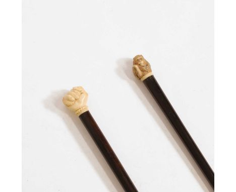 Two ivory and Macassar ebony walking sticks,  one example with the handle carved as a seated monkey, signed,  89cm long, the 