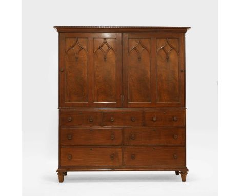 A mahogany cabinet, early 19th century, in the manner of Gillows of Lancaster, with Gothic tracery doors enclosing later shel