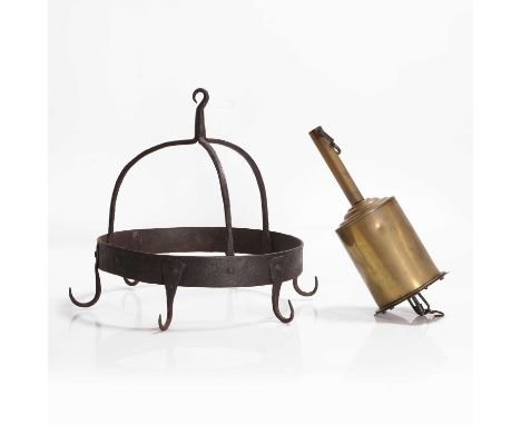 A wrought-iron game hanger, probably 19th century, with six hooks,34cm diameter30cm high, anda brass bottle jack,29cm high (2