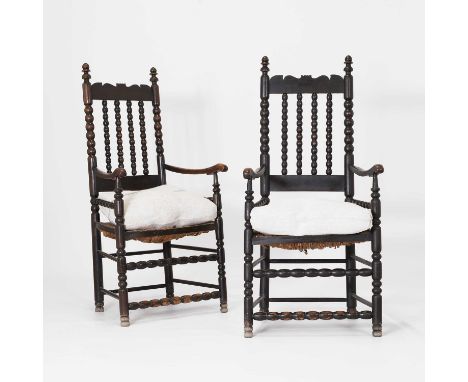 A pair of beechwood elbow chairs, 20th century, each with bobbin turning, rush seat and a cushion,56cm wide47cm deep16.5cm hi