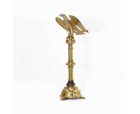 A Victorian gilt-brass spread eagle lectern, the eagle standing on a half-round orb, atop a spirally reeded and knopped colum