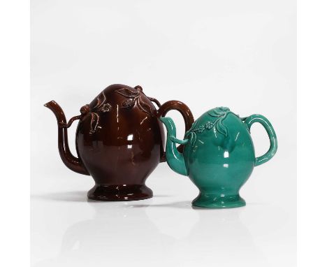 Two Cadogan teapots, 19th century, one treacle glazed, with floral and berry moulded decoration, the other similar but green 