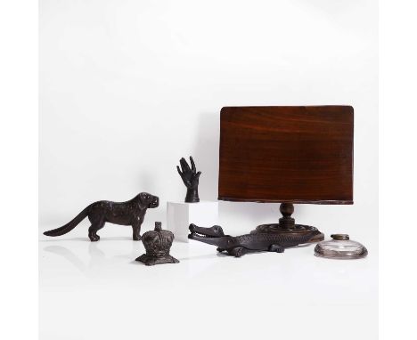 A collection of desk accessories, late 19th century, comprising:an adjustable mahogany stand,35cm widea Victorian cast iron h