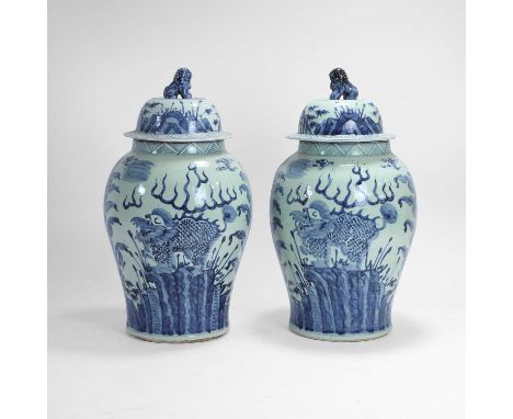 A pair of large blue and white baluster vases and covers, 20th century, Chinese, decorated with mythical creatures amongst fo