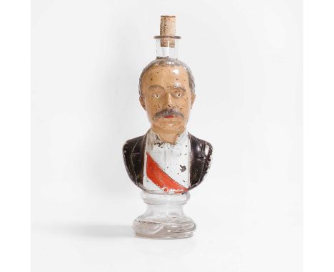 A polychrome-painted glass figural bottle, possibly Legras, in the form of a gentleman with red sash, with enamelled decorati