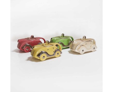 Four Sadler pottery teapots and covers, c.1930s, each in the form of a racing car with silvered highlights, impressed marks, 