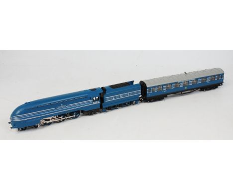 A Hornby blue streamlined LMS 'Coronation' engine and tender together with 3 matching coaches (G) and sold with boxed Hornby 