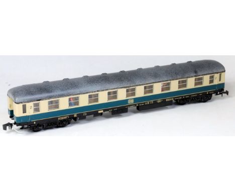 A Lima DB blue/cream 2nd class bogie coach with compartment for batteries to operate internal lighting, some small marks to g