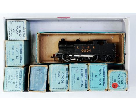 A Hornby Dublo 3-rail 0-6-2 tank engine LNER No. 9596 (F) together with 8 boxed D1 wagons (G-BFG)