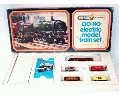 Wrenn set box containing LMS maroon 2-6-4 tank engine, 3 wagons, brake van, track oval (G-BP)