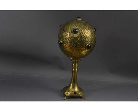 An unusual North African of Moresque globe-shaped brass table lamp, the spherical shade with arabesque fretwork decoration an