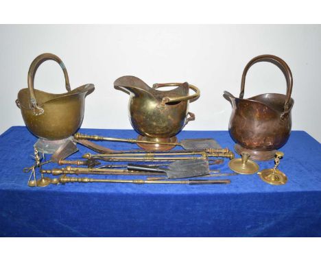 19th and 20th century brass and copper fire side accessories, including three coal scuttles, pokers and tools, two candle hol