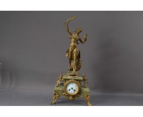 A Late 19th to Early 20th Century French Spelter and Onyx Mantel Clock, the top with a figure entitled "Le Progress Par Bruch