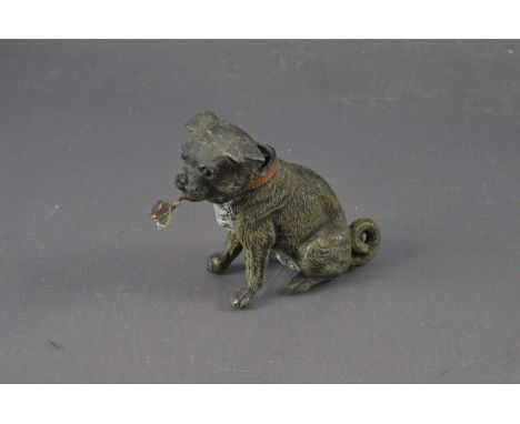 An antique cold-painted spelter figure of a nodding dog, smoking a pipe. Probably Austrian. 7 cm high.