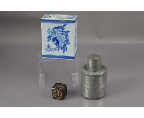 A Chinese Qing dynasty blue and white porcelain headrest or opium pillow, together with a pewter tea caddy and a large brown 