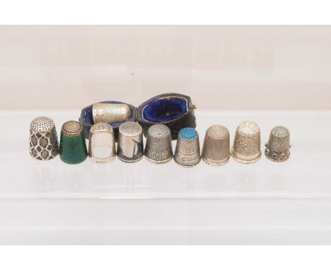 Ten silver thimbles, one silver gilt and green enamel example from Norway, and others, also a thimble case (11)