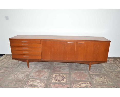 A c1960s teak sideboard by Maple, AF, wear to top, with light wood interior, 215cm wide, chromed handles, 47cm deep and 73cm 