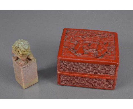 A Chinese carved cinnabar lacquer box, late 19th Century. Together with a soapstone seal with a carved foo dog top. The box 8