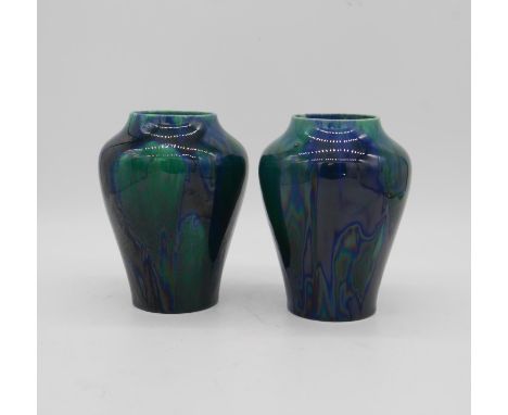 A pair of vintage Podmore and Sons Ltd fritz oil slick blue and green glazed ceramic vases. Makers mark to the base. H20cm 