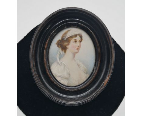 A 19th century ebonised framed and glazed portrait miniature on ivory of a lady in white silk dress with pearl headdress. Uns