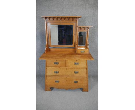 A late 19th century Arts and Crafts light oak dressing chest H.163 W.107 D.55cm 