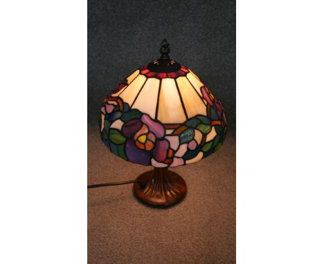 A Tiffany style leaded and coloured glass table lamp. 