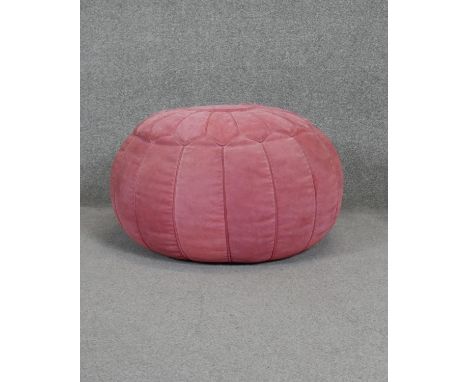 A vintage blush pink suede Moroccan style pouffe. 