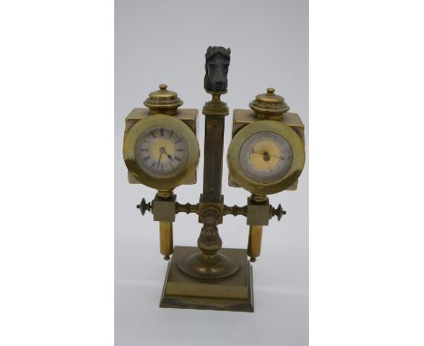 A 19th century brass and bronze clock barometer. The barometer and clock in the form of horse drawn carriage lanterns with re
