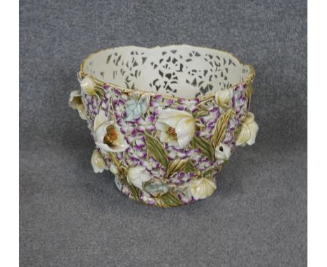An early 20th century Zsolnay ceramic hand painted jardinere, pierced and moulded with tulips, cyclamen and leaves. Makers ma