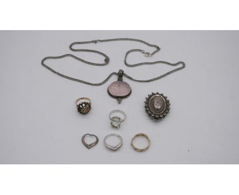 A collection of silver jewellery. To include a silver Victorian locket, a rose quartz pendant with silver curb link chain, a 