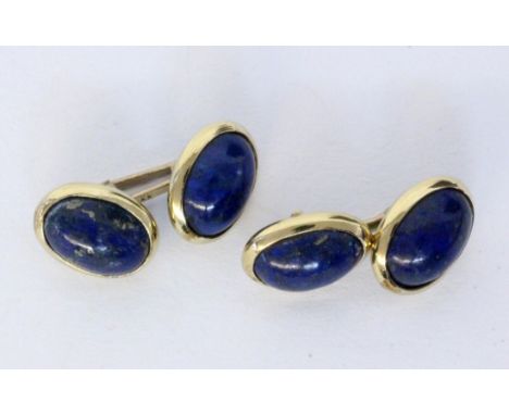   PAAR MANSCHETTENKNÖPFE  333/000 Gelbgold mit Lapislazuli. Brutto ca. 7,9g        A PAIR OF CUFFLINKS 333/000 yellow gold wi