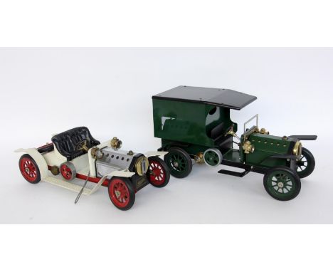   ZWEI OLDTIMER MIT DAMPFBETRIEB.  Metall. L. ca. 38cm        TWO CLASSIC CARS WITH STEAM OPERATION Metal. Approx. 38 cm long