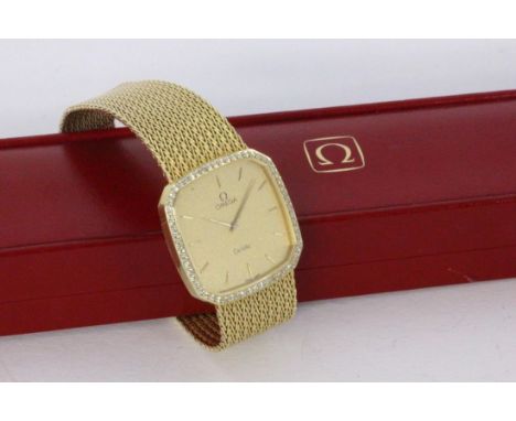  OMEGA "DE VILLE" HERRENARMBANDUHR 585/000 Gelbgold mit Milanaise-Armband und brillantbesetzter Lunette. Quarzwerk, Cal. 1387