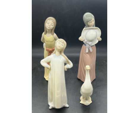 Three Nao figures and one duck in similar styles 