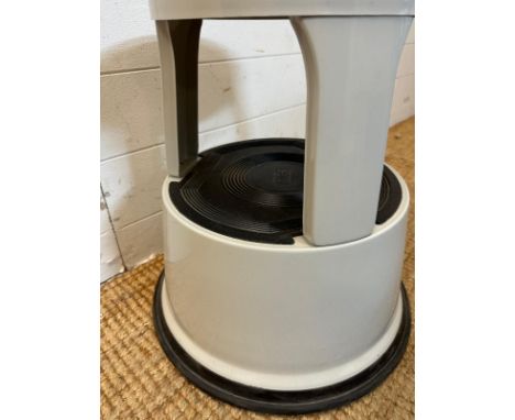 A grey Pavo metal step or kick stool