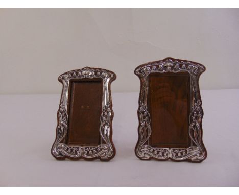 Two Art Nouveau style photograph frames with hallmarked silver mounts