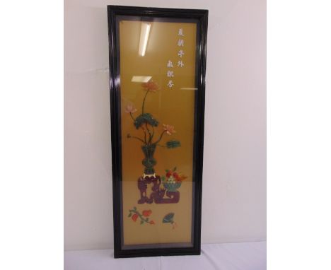A framed and glazed early 20th century Oriental signed panel set with jade, coral and semi precious stones, 92 x 29cm