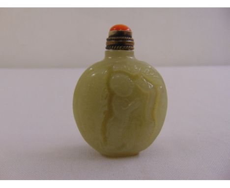 A celadon jade scent bottle of oval form with a coral stopper